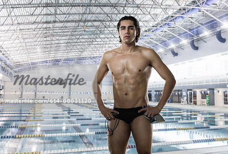 Male swimmer wearing swimming trunks at swimming pool