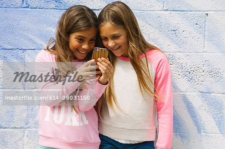 Two girls using smartphone