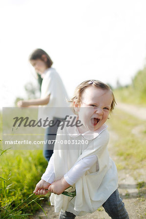 2 young girls in the country in spring