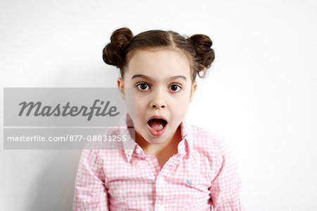 Portrait of a 8 years old girl, astonished air