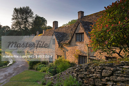 Picturesque cottages at Arlington Row in the Cotswolds village of Bibury, Gloucestershire, England, United Kingdom, Europe