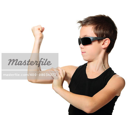 Sport child boy showing his hand biceps muscles strength isolated on white background