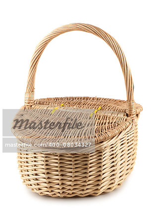 Picnic wicker basket with lid isolated on white background