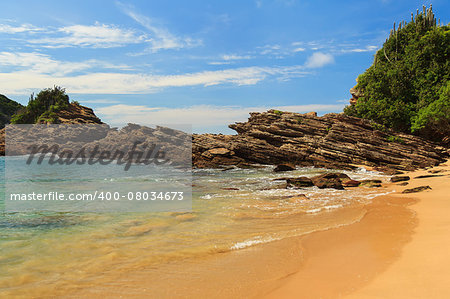 Small beach Ferradurinha sea sand water rock  in Buzios near Rio de Janeiro, Brazil