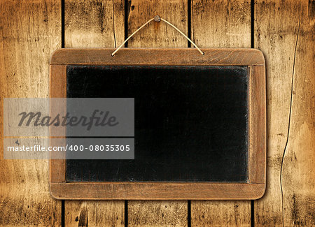 Blackboard on a old wood wall background texture