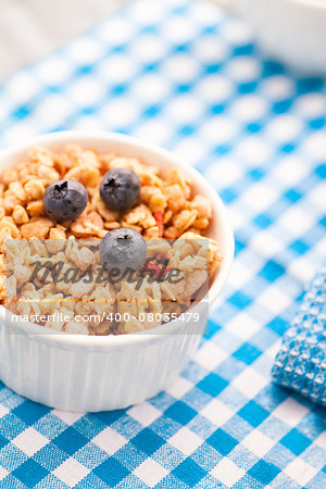 Healthy breakfast. Fruit cereal, muesli with jam and blueberries