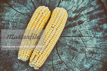 Corn cob on old wooden table