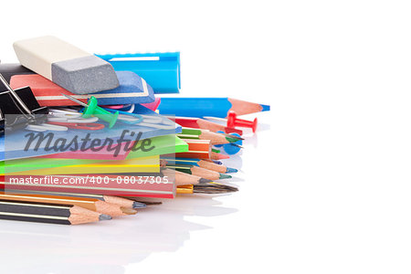 School and office supplies heap. Isolated on white background with copy space