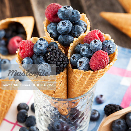 Fresh blueberry, blackberry and raspberry in waffle cone