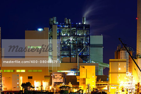 power station at night with smoke , hong kong