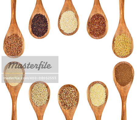 a variety of gluten free grains and seeds (buckwheat, amaranth, brown rice, millet, sorghum, teff, black, red and white quinoa, golden fax on wooden spoons isolated on white with a copy space