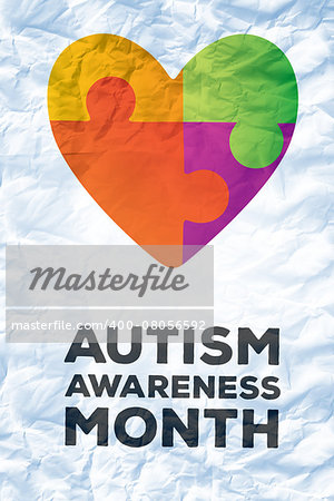 autism awareness month against crumpled white page