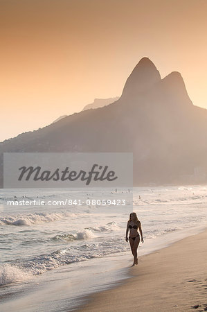 Ipanema and Leblon beach at sunset with the Morro dos Dois Irmaos (Two Brothers) hills behind, Rio de Janeiro, Brazil, South America