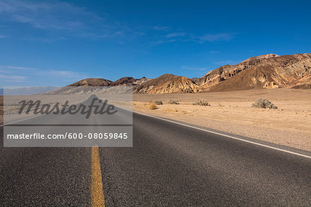 Paved Road in Desert Landscape, Death Valley National Park, California, USA