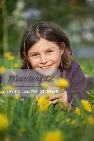 Close-up of Girl Lying in Meadow in Spring, Upper Palatinate, Bavaria, Germany