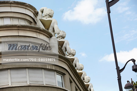 Architectural Detail of Sculptures at top of Building, Paris, France