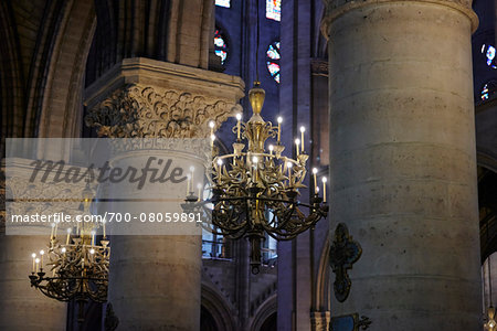 Chandeliers and Pillars inside Notre Dame Cathedral, Paris, France