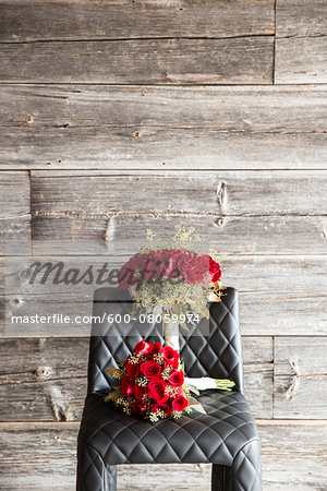 Bouquets of Roses on Chair with Wooden Background