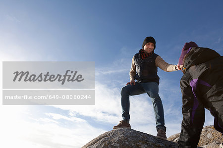 Couple on top of rock, Connemara, Ireland