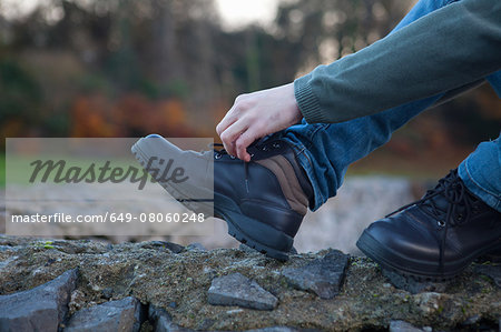 Man tying shoelace, Connemara, Ireland