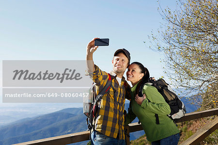 Hikers taking selfie, mountains in background, Montseny, Barcelona, Catalonia, Spain