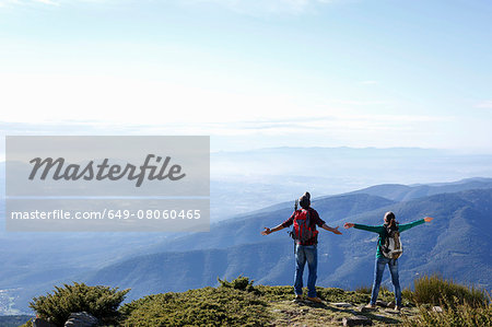 Hikers enjoying view from hilltop, Montseny, Barcelona, Catalonia, Spain