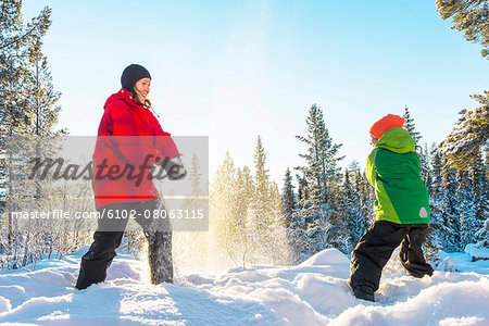 Mother with son playing at winter