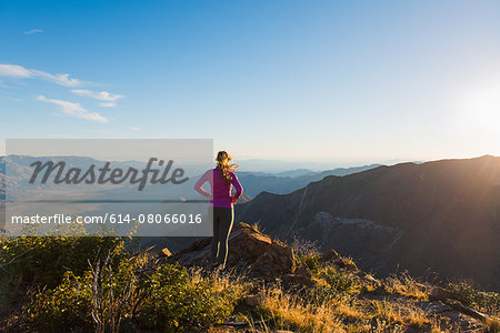Young female trail runner looking at view on Pacific Crest Trail, Pine Valley, California, USA Young female trail runner looking at view on Pacific Crest Trail, Pine Valley, California, USA