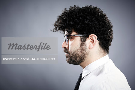 Profile of young man with black curly hair