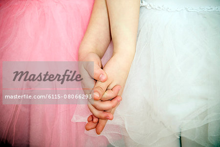 Two little ballerinas holding hands