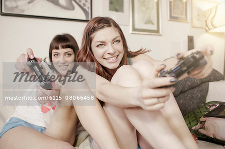 Two young women playing video games