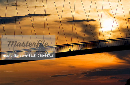 Pedestrian footbridge over Drava river at sunset, Osijek, Croatia