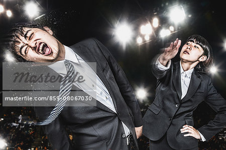 Japanese businessmen fighting extremely