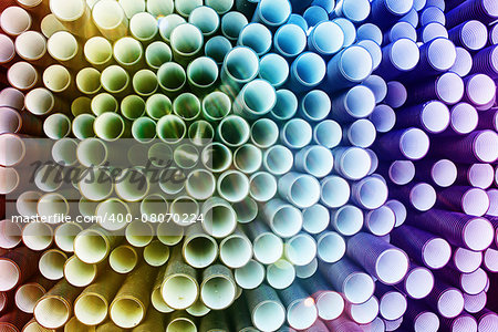 background of colorful big plastic pipes used at the building site.
