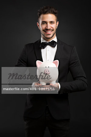 Businessman holding a moneybox