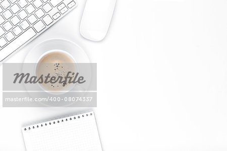 Office desk table with computer, supplies and coffee cup. Top view with copy space