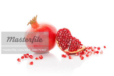 Pomegranate isolated on white background. Healthy fruit eating.