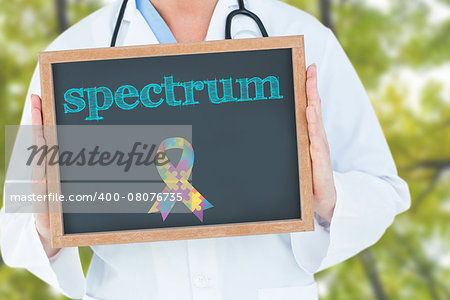 The word spectrum and doctor showing chalkboard against low angle view of tall trees