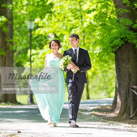 Bride and groom. Portrait of a loving wedding couple strolling in Tivoli park in Ljubljana, Slovenia.