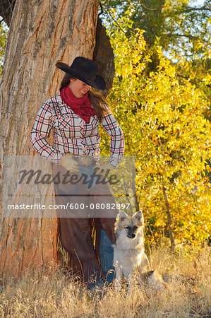 Portrait of Cowgirl with Dog, Shell, Wyoming, USA