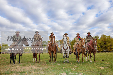 Cowboys and Cowgirls in a row Sitting on their Horses, Shell, Wyoming, USA