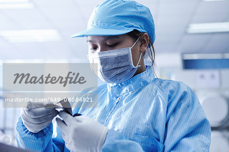 Worker at e-cigarettes battery factory, Guangdong, China