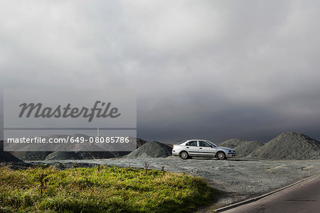 Silver car parked in slate mine