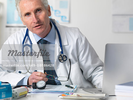 Portrait of doctor consulting a patient in office