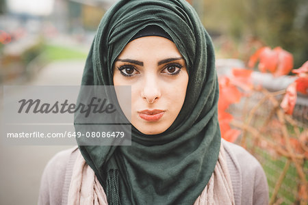 Close up portrait of young woman wearing hijab