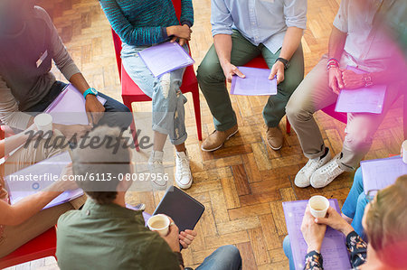 Group therapy session forming circle Group therapy session forming circle