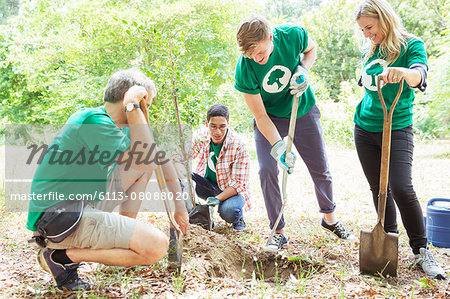 Environmentalist volunteers planting new tree