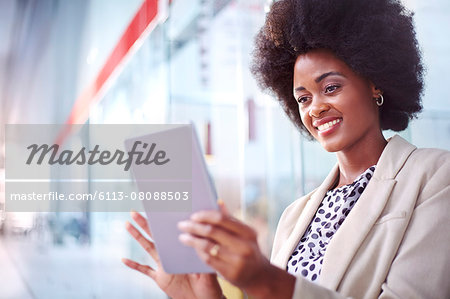 Smiling businesswoman using digital tablet