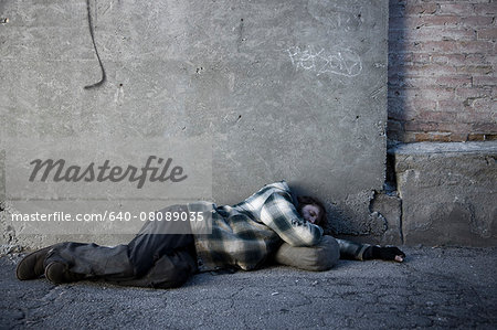 USA, Utah, Satl Lake City, homeless man sleeping in street