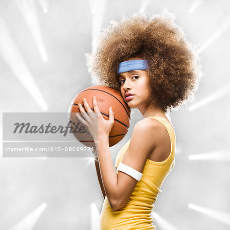 female basketball player with an afro